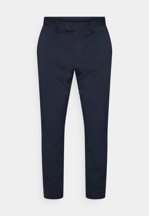 Marineblå bukser med rette ben. Laget av teksturert stoff, med knappelukking foran og subtil detaljering i linningen.