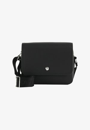 Black textured crossbody bag with flap closure, silver logo button, and adjustable branded shoulder strap on a white background.