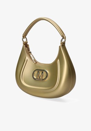 Gouden Marc Ellis handtas met een gebogen handvat, ritssluiting en prominent "M"-logo aan de voorkant in het midden.