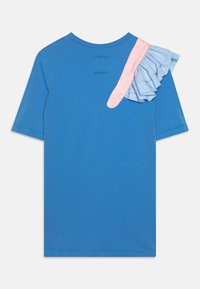 Blue cotton T-shirt featuring a pink and light blue ruffled accent on the shoulder. Short sleeves and a round neckline.