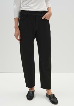 CITY CARRIEL - Trousers - black
