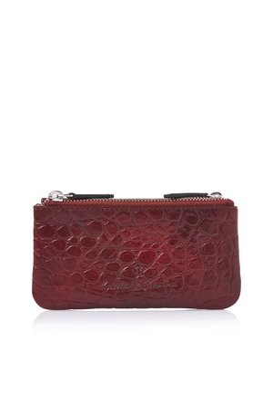 Small rectangular dark red crocodile-embossed leather pouch with two silver zipper pulls on top.