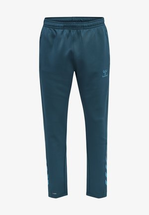 Track pants in dark teal, made of soft fabric. Features elastic waistband, side stripes, and logo on the leg. Designed for comfort.