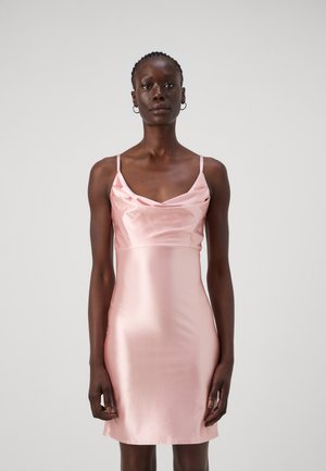 Satin slip dress in soft pink, featuring a cowl neckline, thin spaghetti straps, and a slim-fit silhouette that falls above the knees.