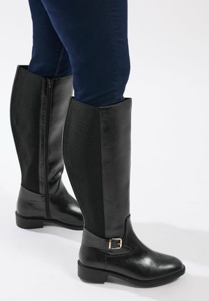 - Kowbojki i obuwie motocyklowe