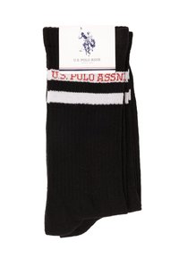 Calcetines negros con textura acanalada, con rayas rojas y blancas y las palabras "U.S. Polo Assn." en el puño, presentados con el embalaje.