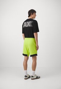 EA7 Emporio Armani Tracksuit bottoms - verde acido