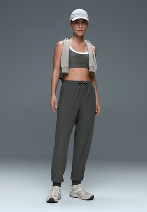 OYSHO, COMFORTLUX MID RISE MARL JOGGERS - Pantalon de survêtement - dark grey melange