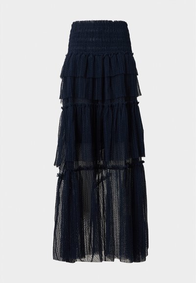 Jupe longue noire en mesh à volants superposés avec taille élastique et détails à volants, semi-transparente en bas.