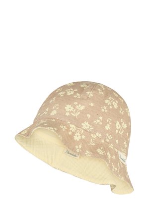 Beiger Fischerhut mit cremefarbenem Blumenmuster und gestepptem Innenfutter aus cremefarbenem Stoff, mit kleinen Stoffmarkenetiketten am Rand.