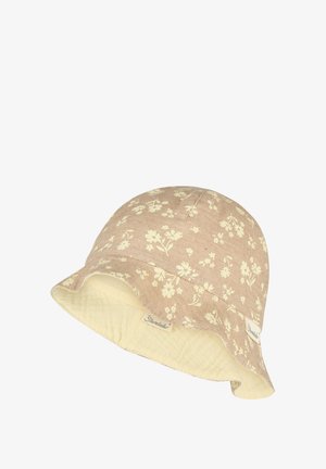Beige bucket hat with cream floral print and quilted cream fabric lining, featuring small fabric brand tags on the brim.