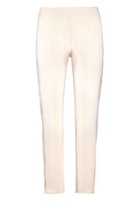 Leggings de couleur crème avec une texture lisse et une taille élastique, ornés de détails en dentelle sur les côtés pour une touche supplémentaire.