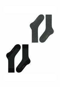 Deux paires de chaussettes : une grise avec une texture côtelée et l'autre noire avec un motif en grille. Les deux ont une hauteur moyenne et un design de orteil sans couture.