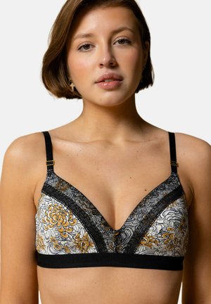 Soutien-gorge noir en dentelle avec un motif floral, orné de fleurs jaunes et blanches, présentant un décolleté plongeant et des bretelles ajustables.