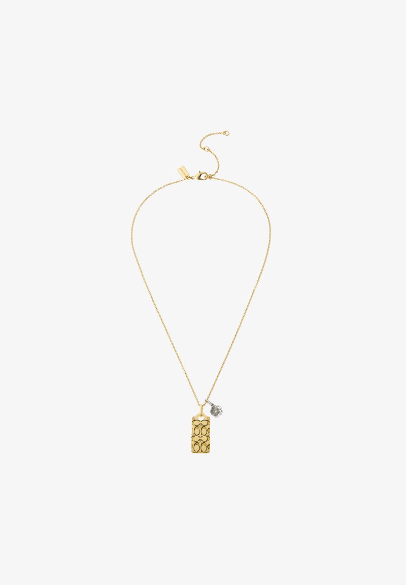 Collana in tono oro con un pendente rettangolare caratterizzato da fori ovali e un piccolo charm decorativo. La catena è delicata e di lunghezza regolabile.