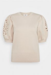 Krémový pletený svetr s nabíranými krátkými rukávy a květinovými výřezy, s kulatým výstřihem a žebrovaným lemem.