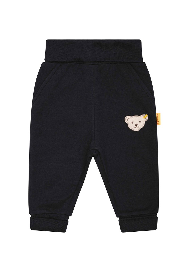 Marineblaue Baumwoll-Jogginghosen mit elastischem Bund, seitlichen Taschen und einer Bärenkopf-Stickerei am linken Bein. Bündchen an den Knöcheln.