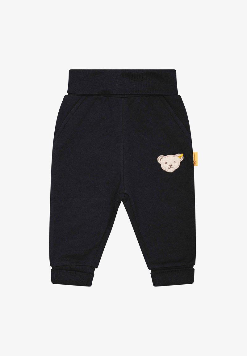 Marineblaue Baumwoll-Jogginghosen mit elastischem Bund, seitlichen Taschen und einer Bärenkopf-Stickerei am linken Bein. Bündchen an den Knöcheln.