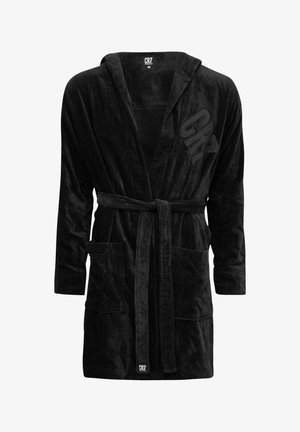 Czarny szlafrok z weluru z przednimi kieszeniami, paskiem i kapturem. Posiada teksturowane wykończenie oraz logo CR7 po lewej stronie. Rozmiar M.