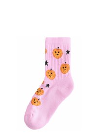 Pink ribbed socks featuring a repeating pattern of smiling orange pumpkins and black stars. Made of soft, stretchy material.
