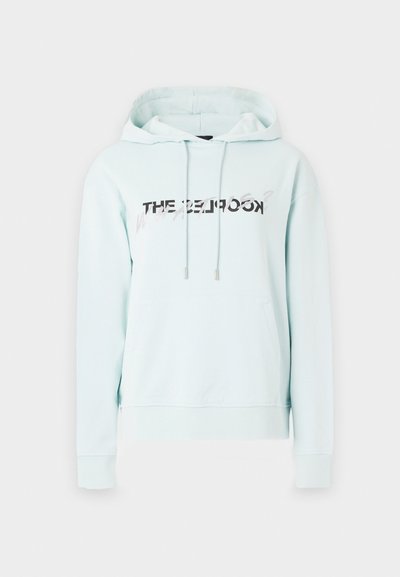 Light blue hooded sweatshirt with a front kangaroo pocket, drawstring hood, and a printed graphic text in black and silver across the chest.
