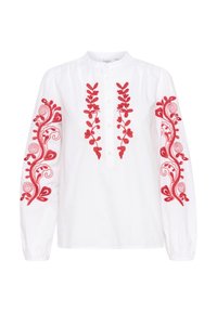 Hvid langærmet skjorte med rød blomsterbroderi på ærmerne og midten af knappestolpen. Har knaplukning foran og samlet skulderdetaljering.
