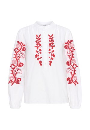 Biela košeľa s dlhým rukávom a červenou kvetinovou výšivkou na rukávoch a strednom zapínaní. Obsahuje zapínanie na gombíky a zhromaždené detaily na pleciach.