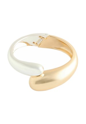 Hinged bracelet with a smooth, curved design featuring gold and silver-tone metal finishes and a visible spring clasp mechanism.