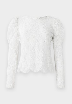 Hvid langærmet bluse i lace med puffede skuldre, blomstermønster, scallop-kant og rund halsudskæring.