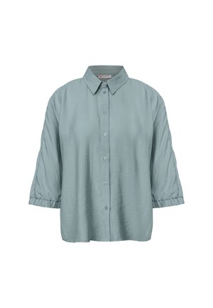 Camicia button-up azzurro chiaro con colletto, vestibilità over size e maniche a sbuffo, realizzata in tessuto testurizzato. Presenta cinque bottoni sulla parte frontale.