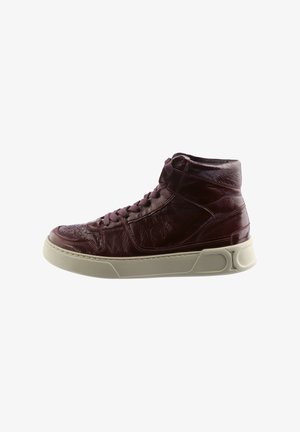 High-top sneakers in dark burgundy leather, featuring a textured finish, round toe, laces, and a contrasting cream rubber sole.