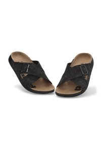 Sandalias negras con tiras cruzadas y upper texturizado, de material sintético, y con una plantilla marrón. Cuentan con una hebilla ajustable y punta abierta.