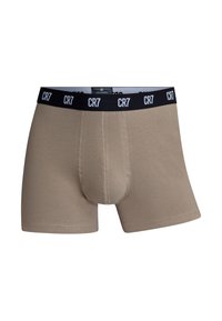 Beige cotton boxer shorts featuring a black elastic waistband with "CR7" branding and a fitted design. Smooth texture with seam detailing.
