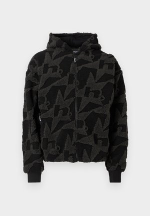 Mustast fliisist kapuutsiga dressipluus, millel on tekstuurse tooniga suurte tähtede muster. Täislukuga ees ja soonikkoes mansetid. Masinpestav.