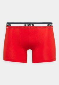 Boxer da uomo rossi con elastico marchiato "Levi's" in nero, accentuato da una striscia bianca. Tessuto morbido e elasticizzato.
