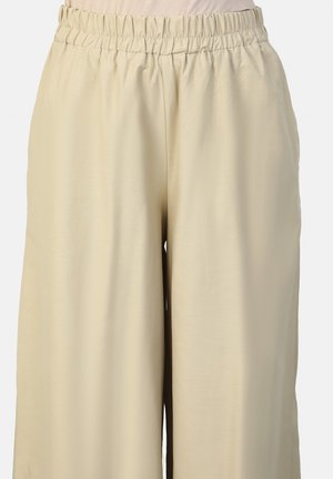 Beige wide-leg pants with an elastic waistband, smooth texture, and a loose fit, providing comfort and ease of movement.