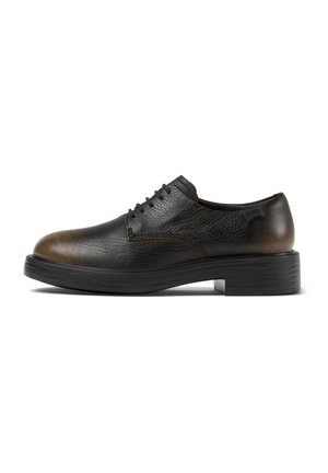Black leather shoes with a smooth texture, rounded toe, and subtle brown accents. Lace-up design and thick black rubber sole.