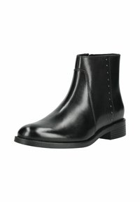 Bottine en cuir noir à talon bas, fermeture éclair latérale et petits clous décoratifs le long de la couture latérale extérieure.