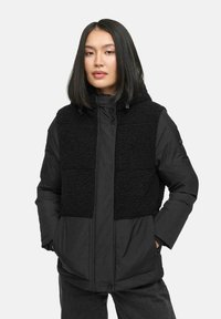 Black jacket featuring a textured shearling front panel, padded sleeves, and a hood. Includes side pockets and button details.