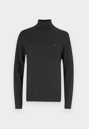 Mørkegrå turtleneck genser laget av mykt strikkemateriale, med lange ermer og en liten brodert logo på brystet.