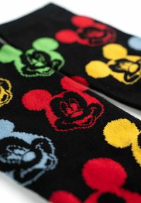 Calze nere con volti colorati di Topolino in rosso, verde, giallo e blu, con un motivo testurizzato e colori a contrasto.