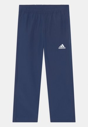 Navy athletic pants made of lightweight fabric with an elastic waistband. Features side pockets and a white Adidas logo on the left leg.