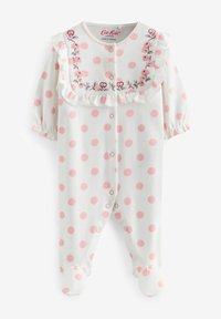Body en coton pour bébé avec des pois roses, fond blanc, col volanté et broderie florale, avec des boutons-pression pour un habillage facile.