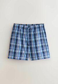 Boxer en coton à carreaux bleu et marine avec taille élastique et cordon à l'avant sur fond clair.