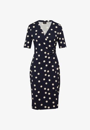 Marineblauwe jurk tot op de knie met witte polka dots, korte mouwen, V-hals en geplooide details aan de rechterkant van de taille.