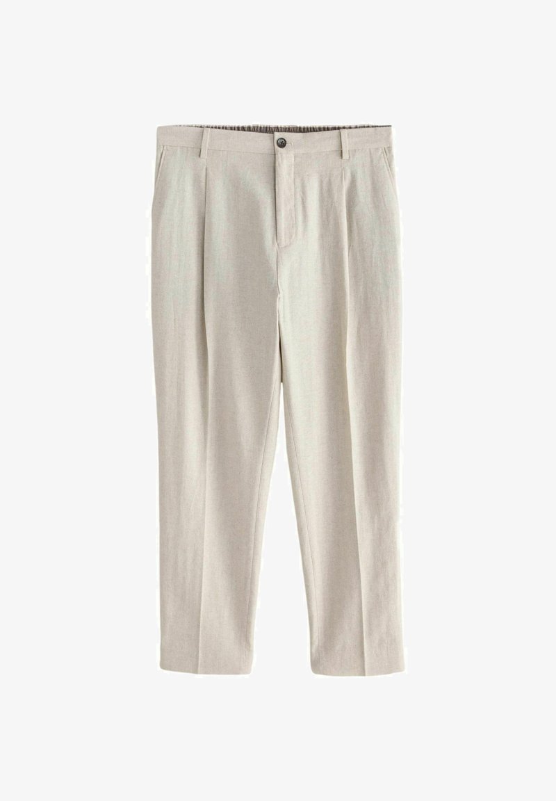 Beżowe eleganckie spodnie z szlufkami na pasek, zapięciem na guzik i zamek błyskawiczny z przodu, bocznymi kieszeniami oraz dopasowanym kantem na nogawkach.