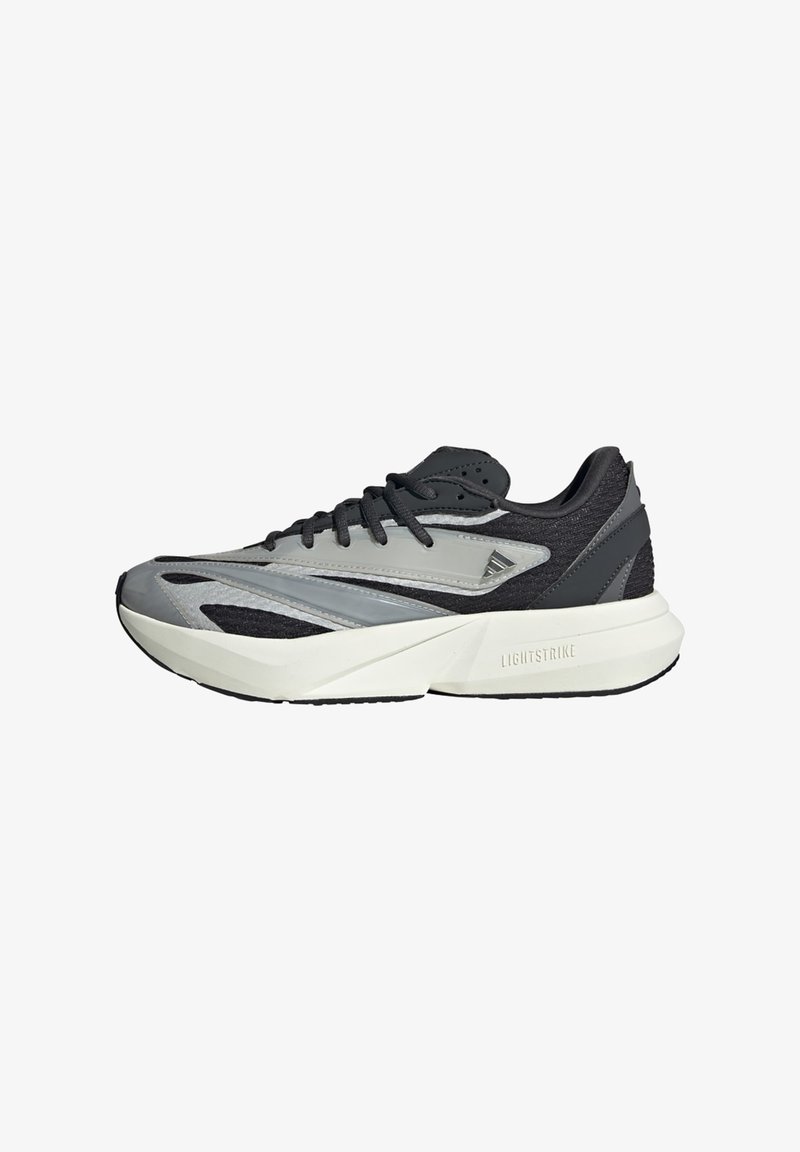 Running shoes featuring a grey and black mesh upper, geometric overlays, a thick white outsole, and textured accents. "LIGHTSTRIKE" branding visible.