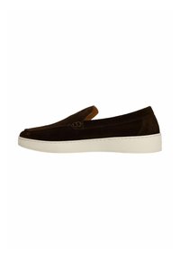 Brown suede slip-on shoe with a low profile, featuring a white rubber sole and a small decorative buckle on the side.
