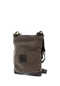 Brown canvas bag with a textured finish, black leather bottom, and gold-tone hardware. Features a detachable shoulder strap and logo patch.