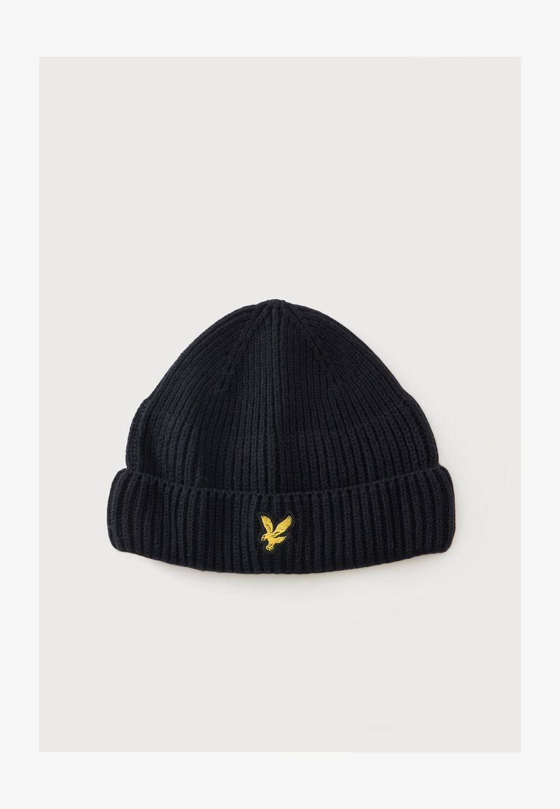 Bonnet en tricot côtelé noir avec revers, orné d’un petit logo aigle jaune brodé au centre devant.